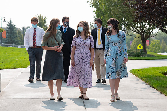 Students going to church on campus with face masks.