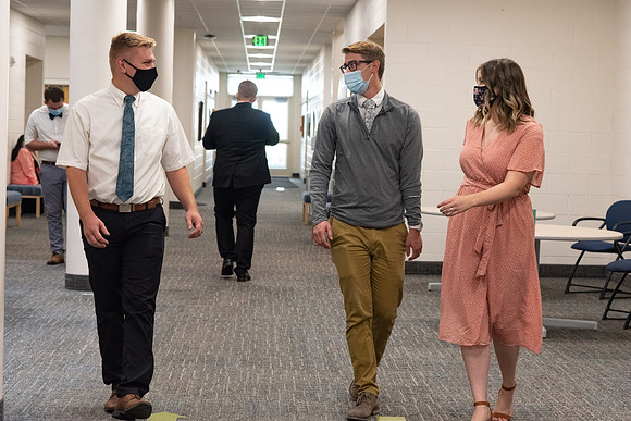 Students wearing face masks at church on campus.