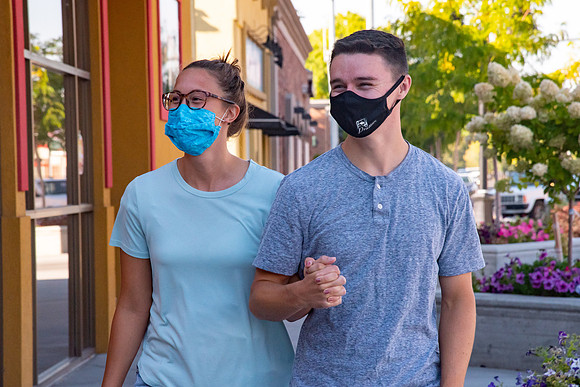 Students walking down the streets of Rexburg with roommates.