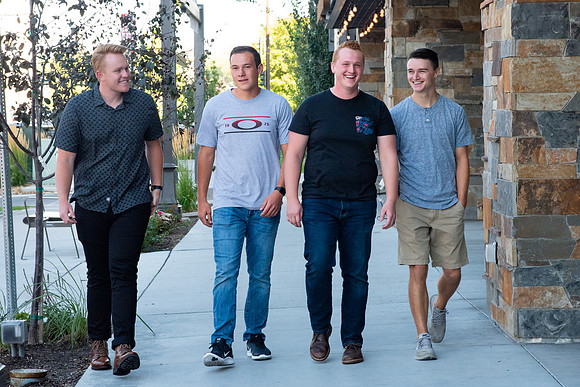 Students walking down the streets of Rexburg with roommates.