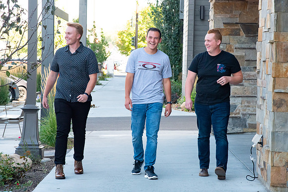 Students walking down the streets of Rexburg with roommates.