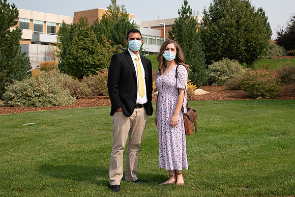 Students smiling at the camera on BYU-Idaho campus after church on a Sunday. Wearing face masks due to the COVID-19 pandemic.