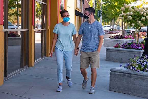 Students walking down the streets of Rexburg with roommates.