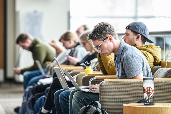Students gather in the BYU-Idaho Center before devotional.