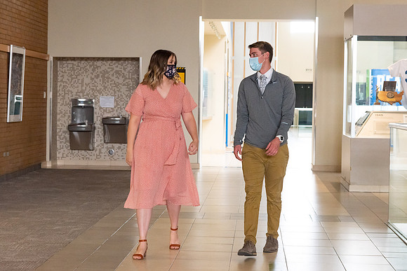 Students going to church on campus with face masks.