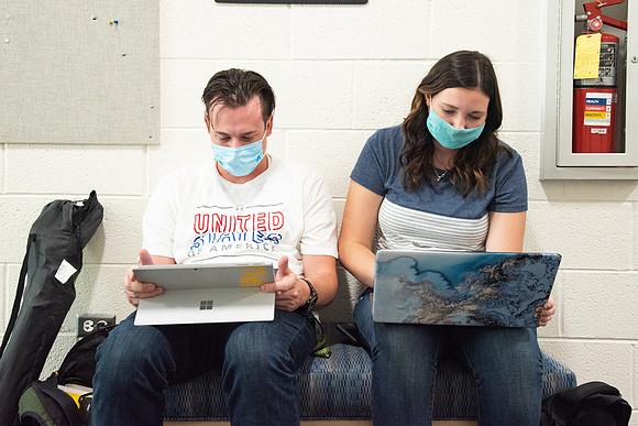 Students wearing face masks and studying on the first day of Fall semester.