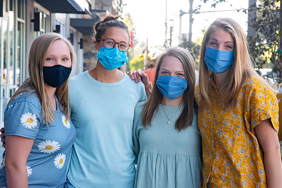Students walking down the streets of Rexburg with roommates.