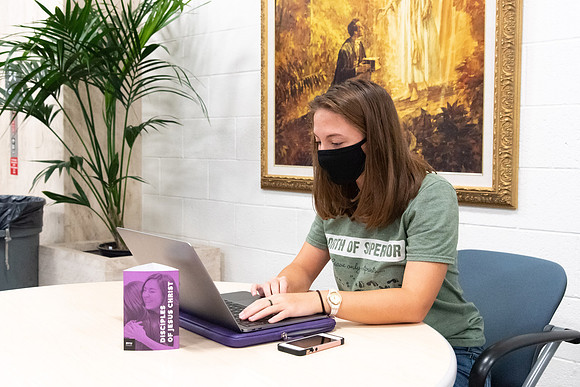 Students wearing face masks and studying on the first day of Fall semester.