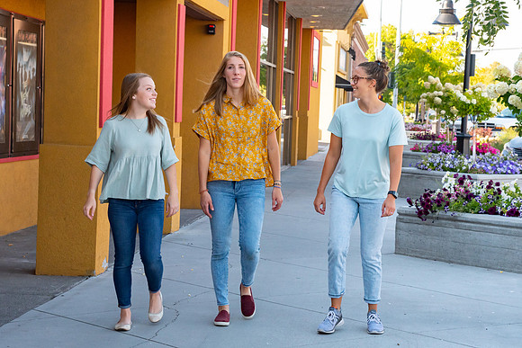 Students walking down the streets of Rexburg with roommates.
