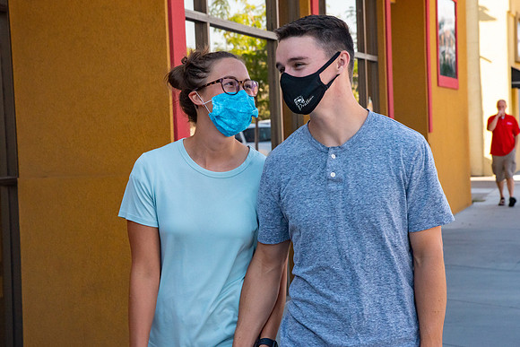 Students walking down the streets of Rexburg with roommates.