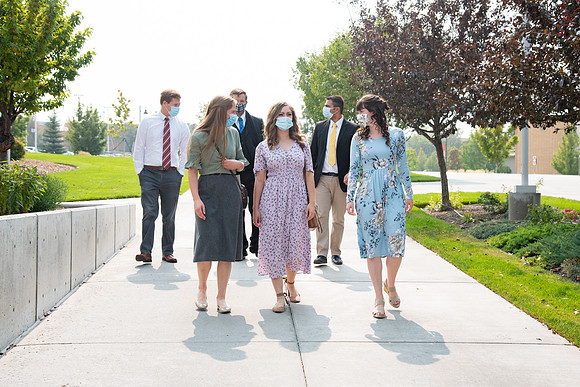 Students going to church on campus with face masks.