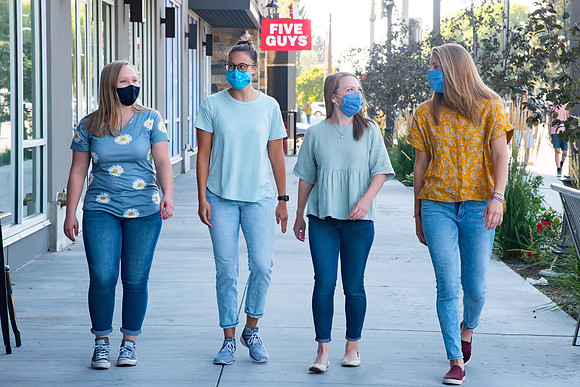 Students walking down the streets of Rexburg with roommates.