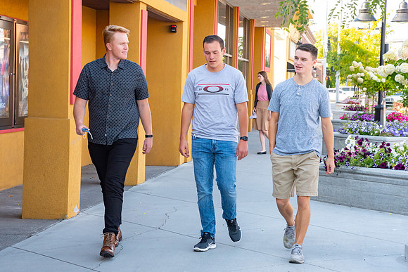 Students walking down the streets of Rexburg with roommates.