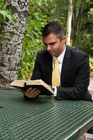 Chris Rodriguez studying his scriptures in the gardens at BYU-Idaho.