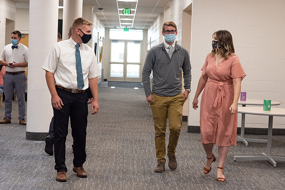 Students wearing face masks at church on campus.