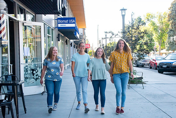 Students walking down the streets of Rexburg with roommates.