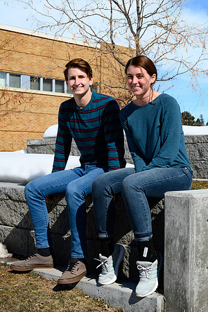 Students studying outside on the first warmer day of the year.
