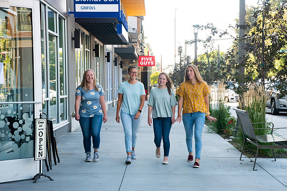 Students walking down the streets of Rexburg with roommates.