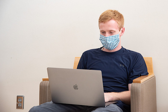 Students wearing face masks and studying on the first day of Fall semester.
