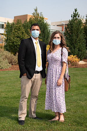Students smiling at the camera on BYU-Idaho campus after church on a Sunday. Wearing face masks due to the COVID-19 pandemic.