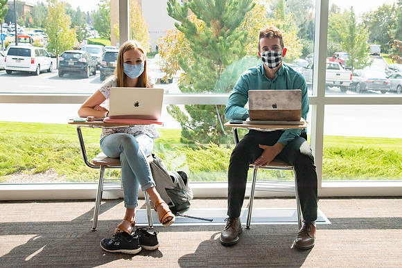 Students wearing face masks and studying on the first day of Fall semester.