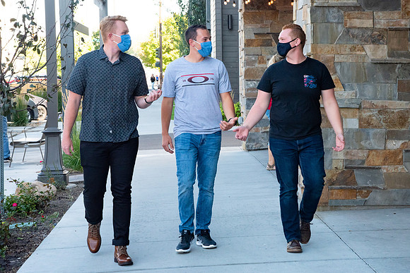 Students walking down the streets of Rexburg with roommates.