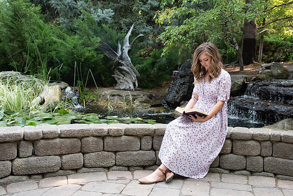 Lydia Cardon reading her scriptures in the gardens at BYU-Idaho.