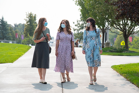 Students going to church on campus with face masks.