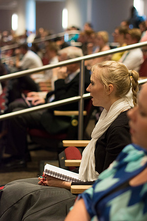 Student listens and takes notes at devotional.