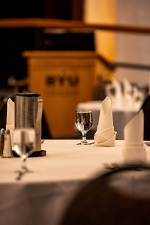 Students gather for a formal dinner, to celebrate a semester of success.