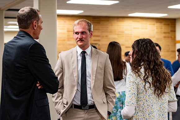 Students gather for a formal dinner, to celebrate a semester of success.