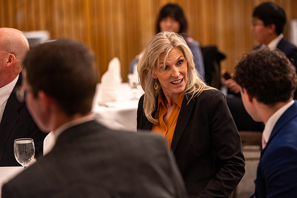 Students gather for a formal dinner, to celebrate a semester of success.
