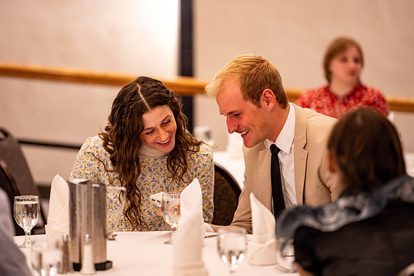 Students gather for a formal dinner, to celebrate a semester of success.