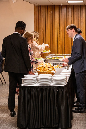 Students gather for a formal dinner, to celebrate a semester of success.
