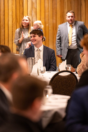 Students gather for a formal dinner, to celebrate a semester of success.