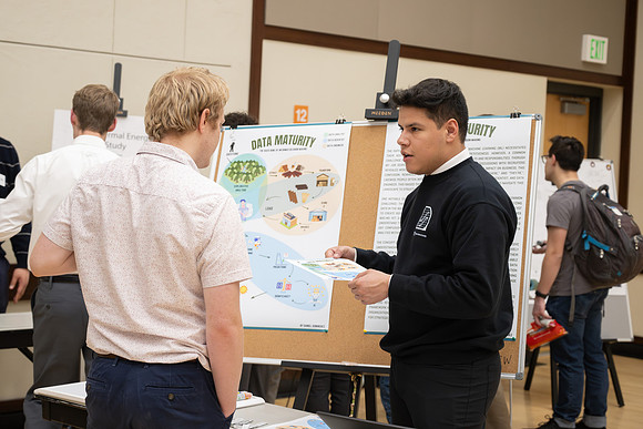 Students present their research at the R&CW Conference.