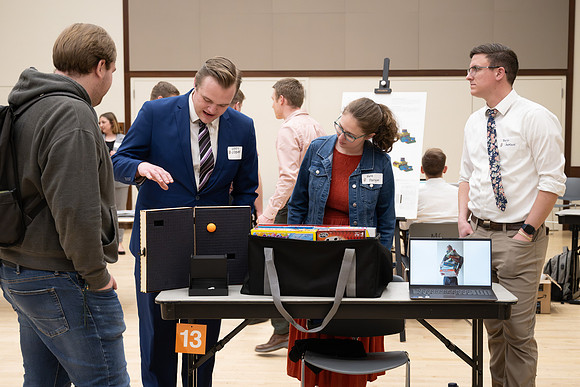 Students present their research at the R&CW Conference.