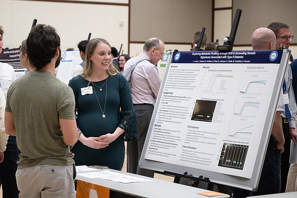 Students present their research at the R&CW Conference.