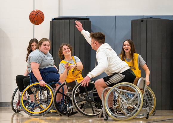 Students participate of Wheelchair Basketball in the Hart Gym.