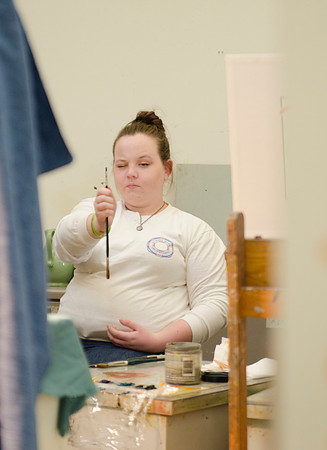 David Belka enthusiatically teaches painting principles to beginning painting class.