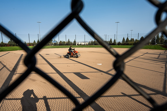 An artist at work grooming the baseball field.  Upper Playing Fields - Oct 2020