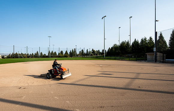 An artist at work grooming the baseball field.  Upper Playing Fields - Oct 2020