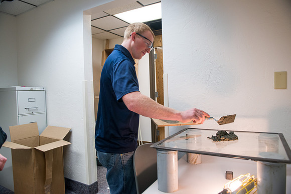 Civil engineering students work with different mixtures of cement to make a light, yet durable, cement that will be the building material for a canoe.