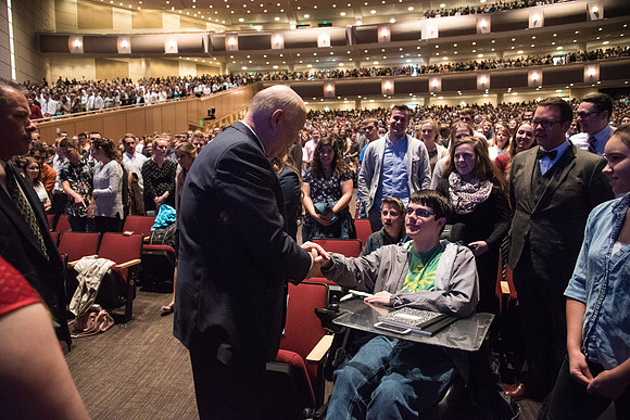 Elder Dale G. Renlund, of the Quorum of the Twelve Apostles, visits with students before beginning his Devotional address.