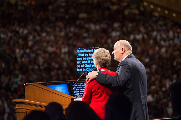 Elder and Sister Dale G. Renlund share the podium as they address the BYU-Idaho students at devotional.