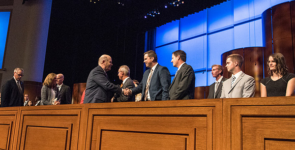 Elder Dale G. Renlund, of the Quorum of the Twelve Apostles, says his goodbyes as he leaves the BYU-Idaho Center.