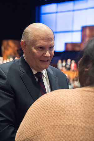 Elder Dale G. Renlund, of the Quorum of the Twelve Apostles, visits with students before beginning his Devotional address.