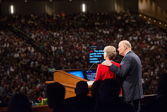 Elder and Sister Dale G. Renlund share the podium as they address the BYU-Idaho students at devotional.