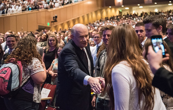Elder Dale G. Renlund, of the Quorum of the Twelve Apostles, visits with students before beginning his Devotional address.