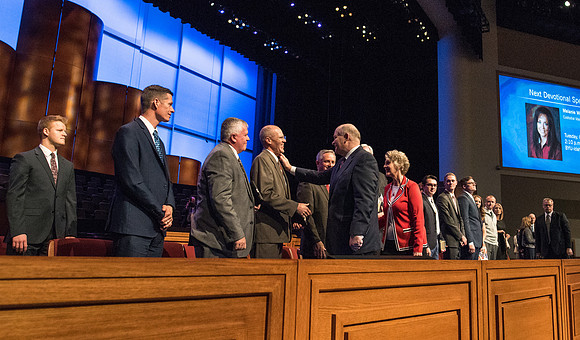 Elder Dale G. Renlund, of the Quorum of the Twelve Apostles, says his goodbyes as he leaves the BYU-Idaho Center.
